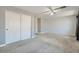 Large bonus room with ample closet space, neutral colors, and plush carpeting, perfect for various activities at 2905 Vigilante Ct, North Las Vegas, NV 89081
