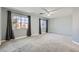 Spacious bonus room with large windows, neutral paint, and plush carpeting, ideal for flexible living at 2905 Vigilante Ct, North Las Vegas, NV 89081