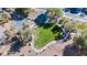 Aerial shot of a neighborhood park featuring lush grass, a shaded gazebo, and walking paths at 2905 Vigilante Ct, North Las Vegas, NV 89081