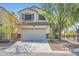 Charming two-story home with a well-maintained front yard, attached two-car garage and a welcoming curb appeal at 2905 Vigilante Ct, North Las Vegas, NV 89081
