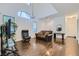 Formal living area with high ceilings, hardwood floors, and comfortable seating, creating an elegant and inviting space at 2905 Vigilante Ct, North Las Vegas, NV 89081