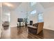 Living room area with hardwood floors and comfortable seating, offering a relaxed and stylish atmosphere at 2905 Vigilante Ct, North Las Vegas, NV 89081