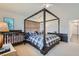 Comfortable main bedroom with a unique canopy bed and furnishings, creating a relaxing atmosphere at 2905 Vigilante Ct, North Las Vegas, NV 89081