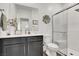 Well-lit bathroom with a single sink vanity, a walk-in shower with glass door, and neutral color palette at 3197 Vittoria Ave, Henderson, NV 89044