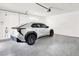 Spacious garage with epoxy floors, car charger, and ample room for parking at 3197 Vittoria Ave, Henderson, NV 89044