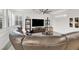 Cozy living room features a large leather sofa and a ceiling fan for added comfort at 3197 Vittoria Ave, Henderson, NV 89044