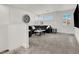 Upstairs living room with a large sectional sofa, stylish decor, and bright windows at 3197 Vittoria Ave, Henderson, NV 89044