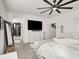 Serene main bedroom with a large TV, comfortable bed, and access to the ensuite bathroom at 3197 Vittoria Ave, Henderson, NV 89044