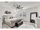 Inviting main bedroom with a plush bed, decorative pillows, and modern ceiling fan at 3197 Vittoria Ave, Henderson, NV 89044