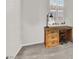 Bright office space with a wooden desk, chair, and natural light from a window at 3197 Vittoria Ave, Henderson, NV 89044