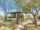 Lush community park featuring a modern structure, landscaping, and walking paths at 3197 Vittoria Ave, Henderson, NV 89044