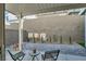 Cozy covered patio featuring a paved area with seating and a charming decorative garden at 3197 Vittoria Ave, Henderson, NV 89044