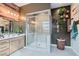 Spa-like bathroom with a large shower, double vanity, and modern fixtures at 3395 Sleeping Hills Ave, Henderson, NV 89044