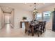 Bright dining room features a rustic wooden table with leather chairs at 3395 Sleeping Hills Ave, Henderson, NV 89044