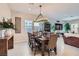 Farmhouse dining room with rustic table, chandelier, and wood accents at 3395 Sleeping Hills Ave, Henderson, NV 89044