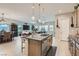Open concept kitchen with island seating and stainless steel appliances at 3395 Sleeping Hills Ave, Henderson, NV 89044