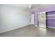 Bedroom with mirrored closet and purple accent wall at 3422 Wayne St, Las Vegas, NV 89121