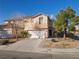 Charming two-story home with a well-manicured front yard and a spacious two-car garage at 3448 Laguna Veneta Ave, Las Vegas, NV 89141