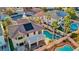 Backyard featuring a pool, jacuzzi, and patio, with lush landscaping, providing a private outdoor living space at 395 Suzanne Peak Ct, Henderson, NV 89012
