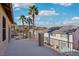 Outdoor balcony showcases neighborhood views, palm trees, and a clear blue sky at 395 Suzanne Peak Ct, Henderson, NV 89012