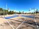 An outdoor community basketball court awaits players with plenty of space to run at 395 Suzanne Peak Ct, Henderson, NV 89012
