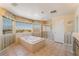 Bright bathroom features a large tub, shower, and beautiful views from the large windows at 395 Suzanne Peak Ct, Henderson, NV 89012