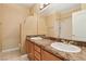 Bathroom featuring double sinks, ample counter space, and a well-lit vanity area at 395 Suzanne Peak Ct, Henderson, NV 89012
