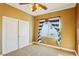 Comfortable bedroom with carpet, closet and bright window with striped curtains at 395 Suzanne Peak Ct, Henderson, NV 89012