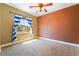Bright bedroom with natural light streaming through the window and neutral carpet at 395 Suzanne Peak Ct, Henderson, NV 89012