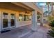 Relaxing covered patio with ceiling fan offers shade and access to the backyard oasis at 395 Suzanne Peak Ct, Henderson, NV 89012
