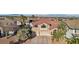 Inviting home featuring desert landscaping, tile roof, and a charming red front door at 395 Suzanne Peak Ct, Henderson, NV 89012
