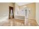 Bright foyer with tiled floor, neutral walls, decorative window and glass-paneled front doors at 395 Suzanne Peak Ct, Henderson, NV 89012
