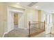 Hallway with carpeted floors, natural lighting and railings at 395 Suzanne Peak Ct, Henderson, NV 89012