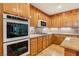 Gourmet kitchen with granite countertops, stainless appliances, and ample cabinet space at 395 Suzanne Peak Ct, Henderson, NV 89012