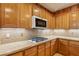 Updated kitchen featuring granite countertops, stainless gas cooktop, and custom wood cabinetry at 395 Suzanne Peak Ct, Henderson, NV 89012