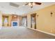 Spacious living room features a fireplace, carpeted floors, and plenty of natural light at 395 Suzanne Peak Ct, Henderson, NV 89012