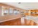 Bright living area features tile and wood floors, with backyard views from the large windows at 395 Suzanne Peak Ct, Henderson, NV 89012