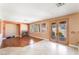 Inviting living area with hardwood floors, fireplace, large windows, and French doors that provides abundant natural light at 395 Suzanne Peak Ct, Henderson, NV 89012