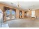 Cozy living room offers a balcony with a view, carpet flooring and curtains at 395 Suzanne Peak Ct, Henderson, NV 89012