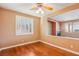 Inviting living room with hardwood floors, shuttered windows, and open layout at 395 Suzanne Peak Ct, Henderson, NV 89012