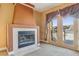 Living room features a fireplace, carpeted floors, and access to a patio at 395 Suzanne Peak Ct, Henderson, NV 89012