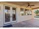 Covered patio featuring double doors leading to home and access to the backyard pool at 395 Suzanne Peak Ct, Henderson, NV 89012