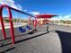A playground features swings, slides, and climbing structures for children at 395 Suzanne Peak Ct, Henderson, NV 89012