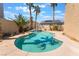 Backyard pool and spa surrounded by lush greenery and a sunny, inviting atmosphere at 395 Suzanne Peak Ct, Henderson, NV 89012