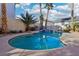 Lush backyard pool with spa and landscaping offers a private and tranquil outdoor living space at 395 Suzanne Peak Ct, Henderson, NV 89012