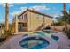 Sparkling pool and spa in backyard is perfect for relaxation and outdoor fun at 395 Suzanne Peak Ct, Henderson, NV 89012
