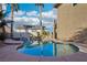 Inviting pool with a relaxing spa and lush landscaping creates a private backyard escape at 395 Suzanne Peak Ct, Henderson, NV 89012