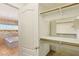 Large walk-in closet with custom shelving and organization system, accessible from the luxurious main bathroom at 395 Suzanne Peak Ct, Henderson, NV 89012