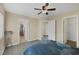 Bedroom featuring a queen bed, ceiling fan and light wood flooring at 11135 Abbeyfield Rose Dr, Henderson, NV 89052