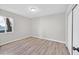 An empty bedroom showing hardwood flooring, a ceiling light, and neutral walls at 1225 S 17Th St, Las Vegas, NV 89104